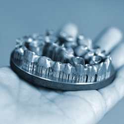 Man,Is,Holding,Object,Printed,On,Metal,3d,Printer.,Dental